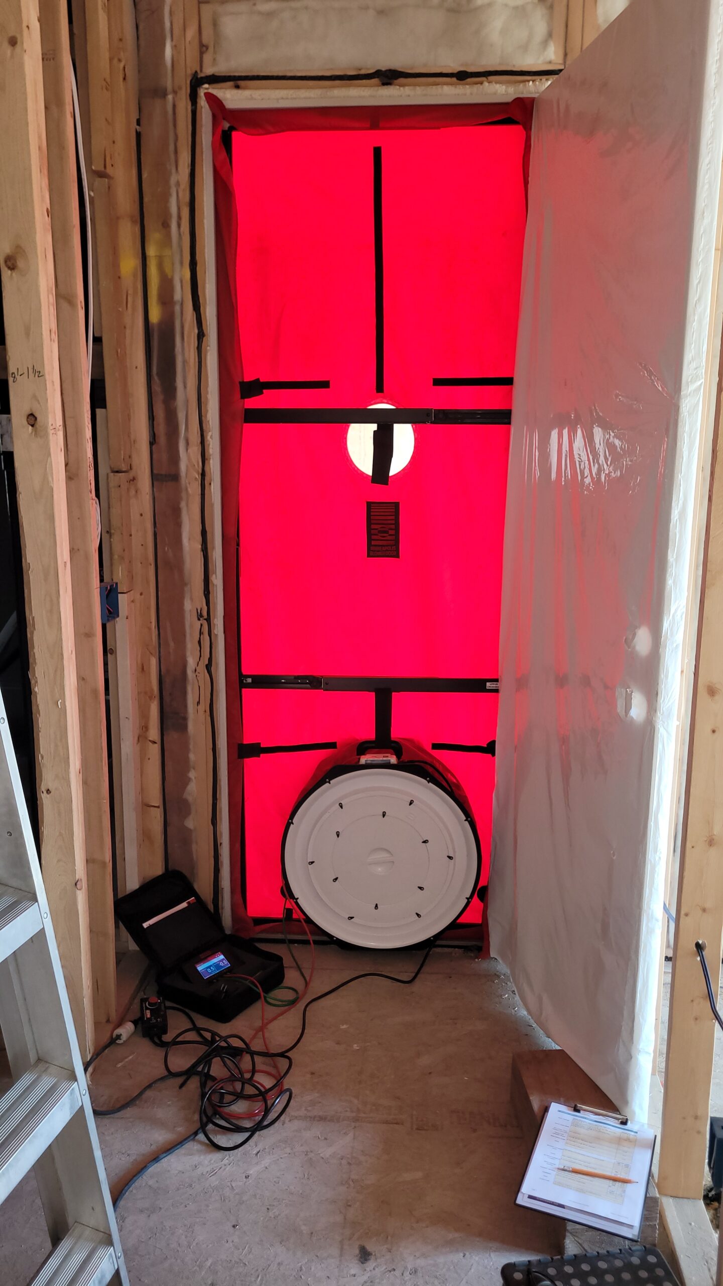 Mid-Construction blower door testing by an Energy Advisor